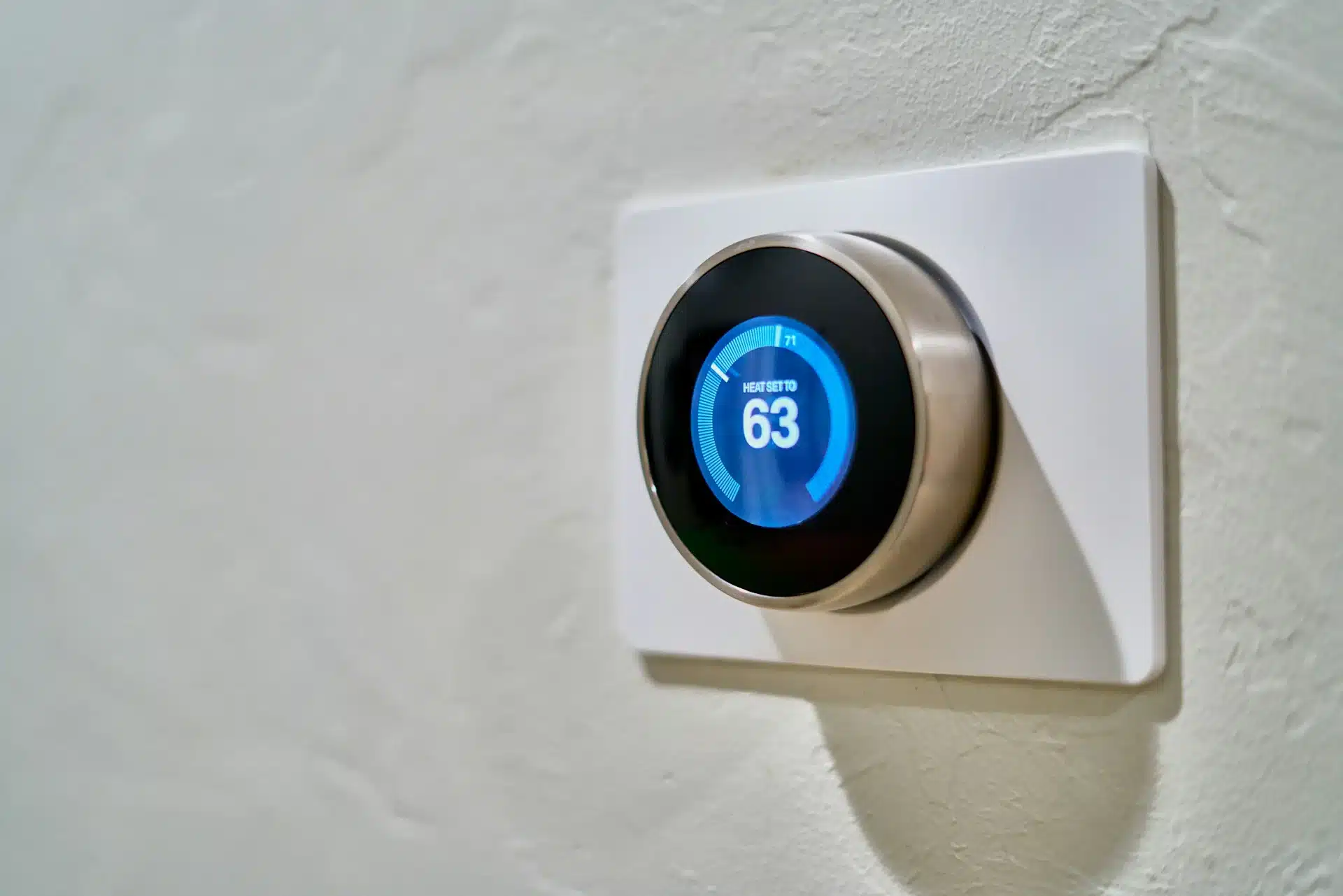 Smart thermostat displaying heat setting, ready for the first furnace run of fall