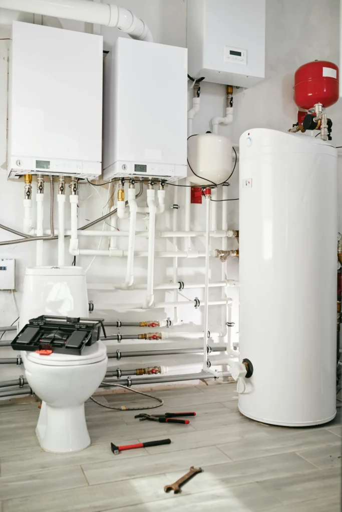 White water heater tank in boiler room